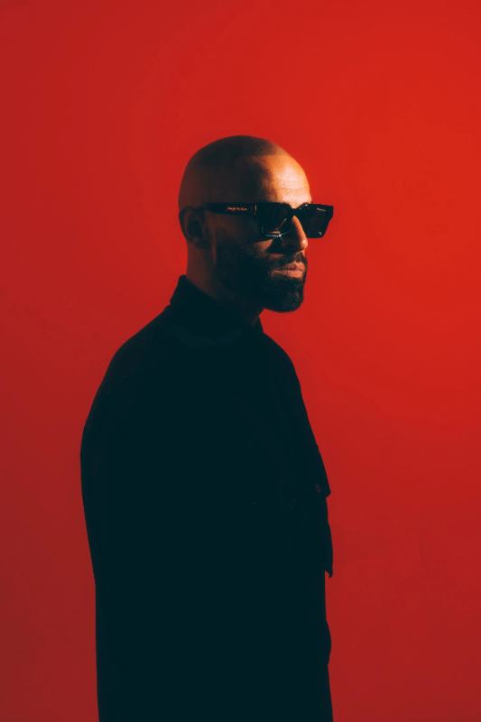 Studio portrait on a red background